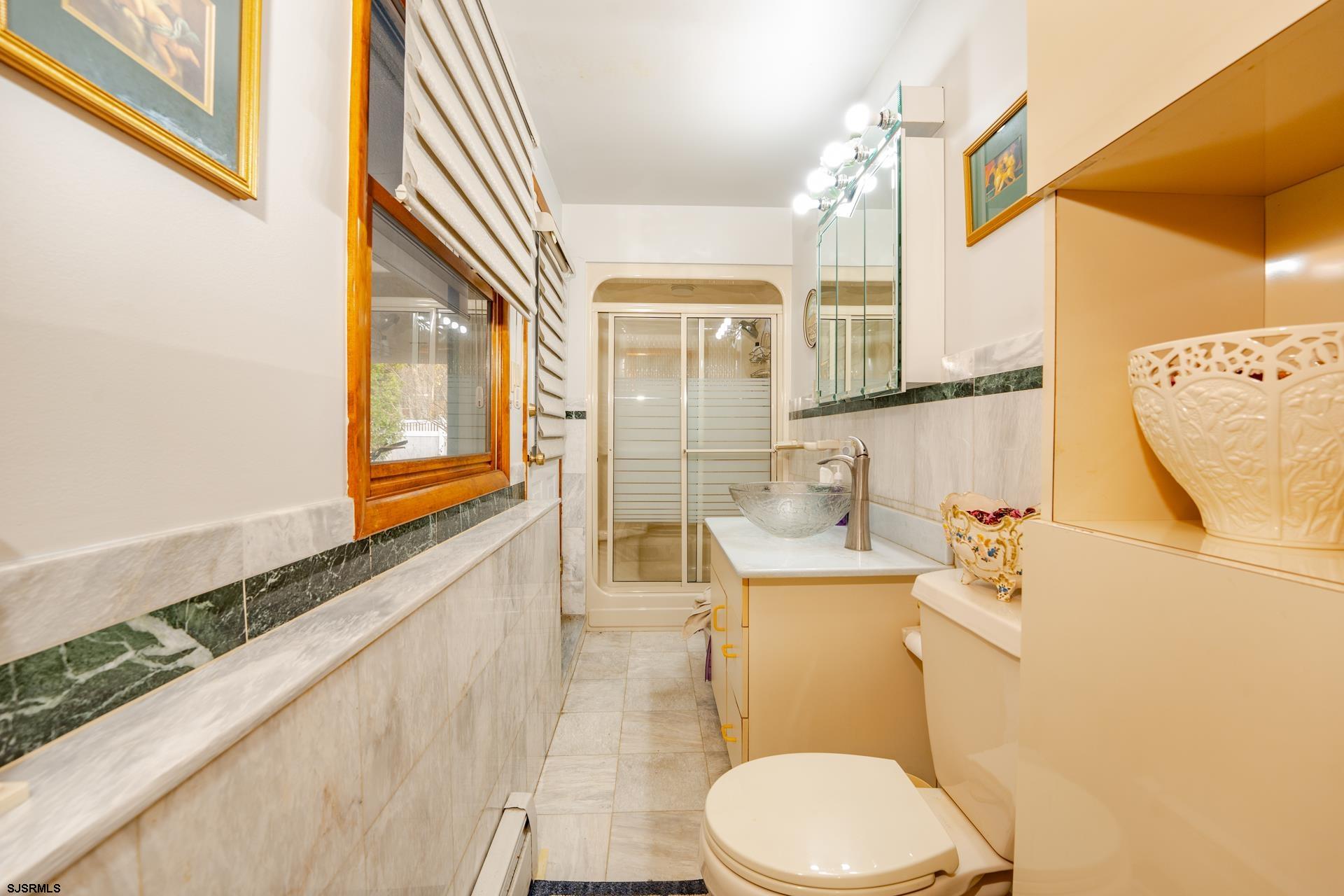 953 Chestnut Avenue Sewell, NJ 08080 - Photo 28 of 76 a bathroom with a sink a toilet and mirror