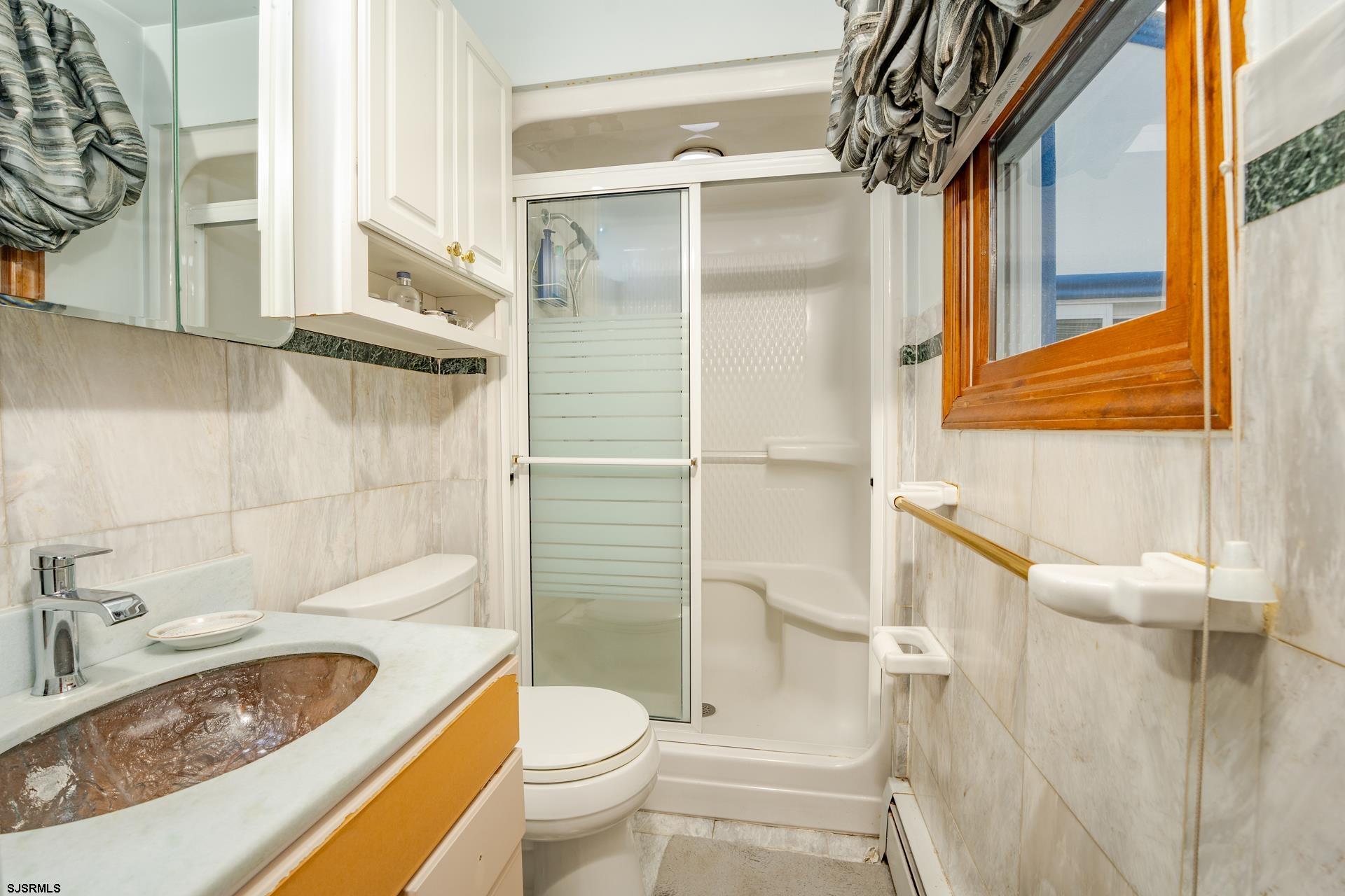 953 Chestnut Avenue Sewell, NJ 08080 - Photo 29 of 76 a bathroom with a sink toilet and shower