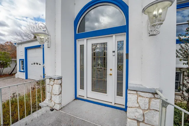 a living room with furniture a rug and a window