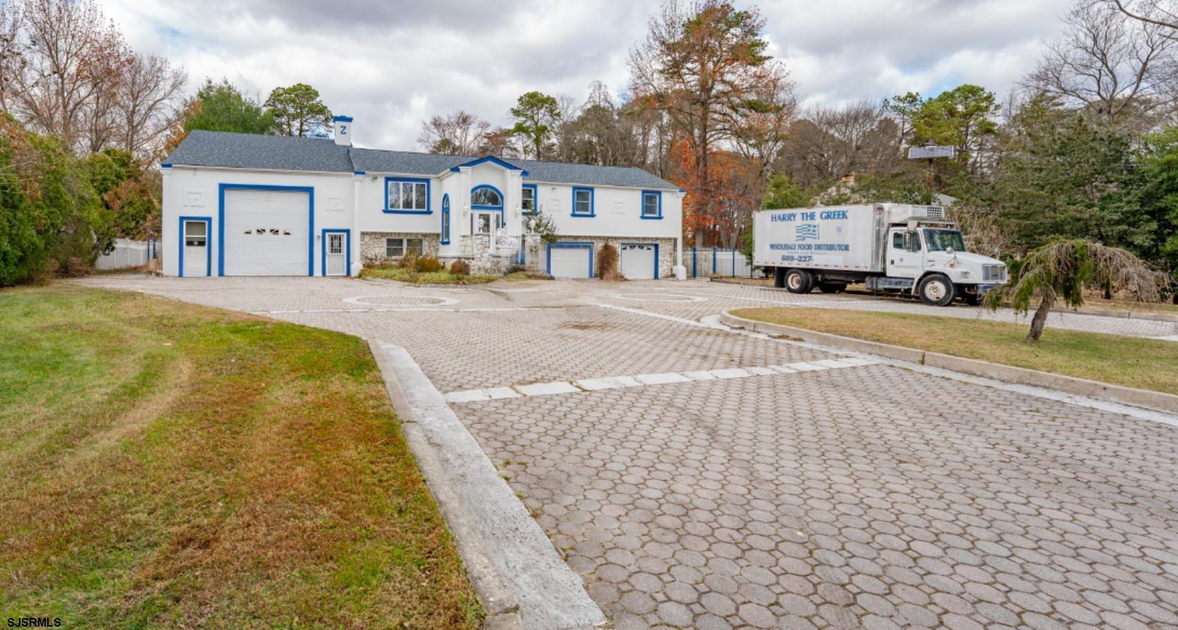 953 Chestnut Avenue Sewell, NJ 08080 - Photo 55 of 76 a front view of a building with cars parked