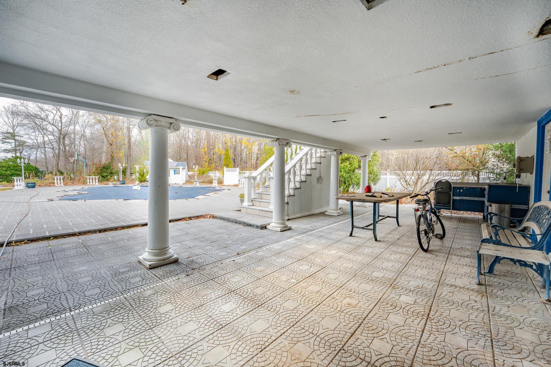 953 Chestnut Avenue Sewell, NJ 08080 - Photo 74 of 76 a view of an empty room with floor to ceiling windows and wooden floor