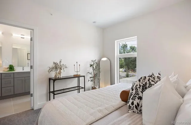 a bedroom with a bed and a dresser