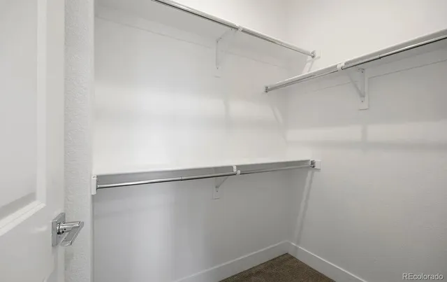 a view of an empty walk in closet