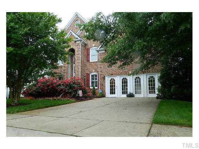 9108 Breeland Way Raleigh, NC 27613 - Photo 1 of 25 a front view of a house with garden