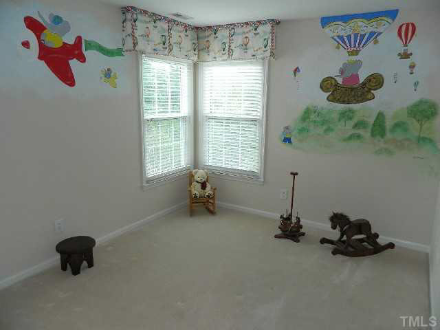 9108 Breeland Way Raleigh, NC 27613 - Photo 20 of 25 a room with toys and stairs