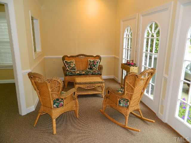 9108 Breeland Way Raleigh, NC 27613 - Photo 22 of 25 a view of a dining room with furniture and windows