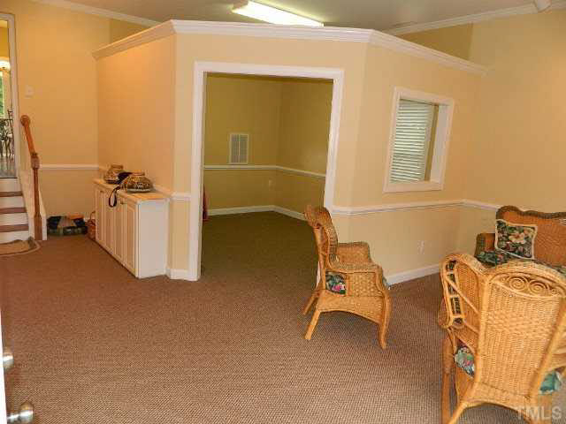 9108 Breeland Way Raleigh, NC 27613 - Photo 23 of 25 a view of a room with gym equipment