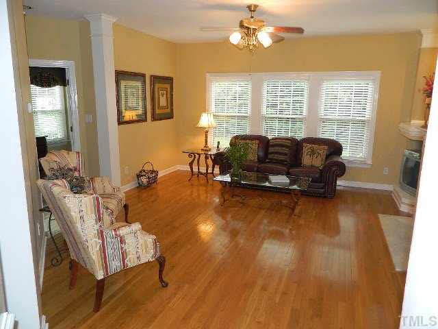 9108 Breeland Way Raleigh, NC 27613 - Photo 6 of 25 a living room with furniture and a large window