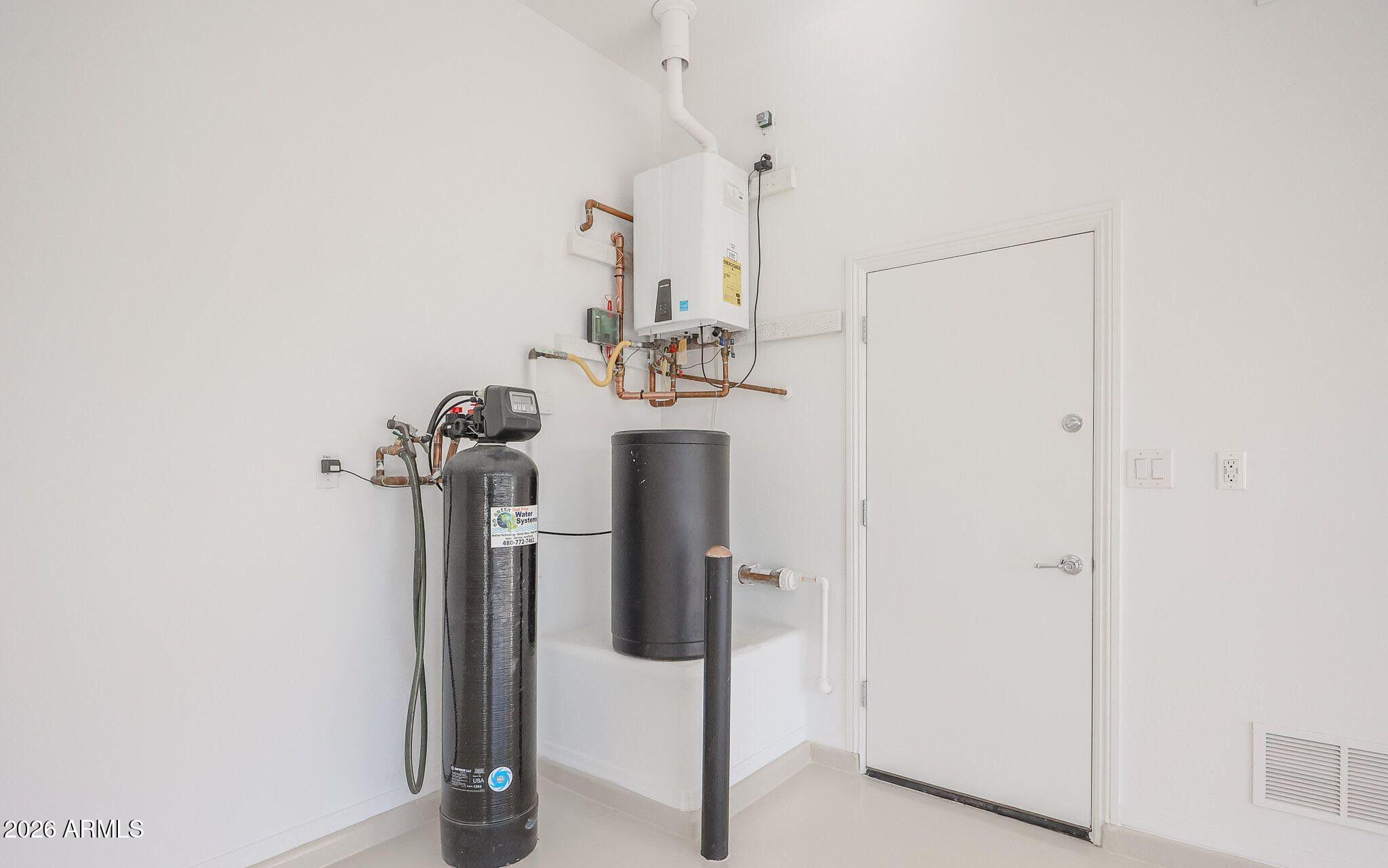 1732 West Gambit Trail Phoenix, AZ 85085 - Photo 40 of 61 Tankless-soft water-garage service door