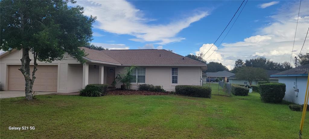 87 Almond Road Ocala, FL 34472 - Photo 1 of 1 a view of a house with a garden