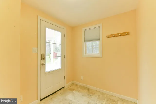 a view of a room that has a window in it