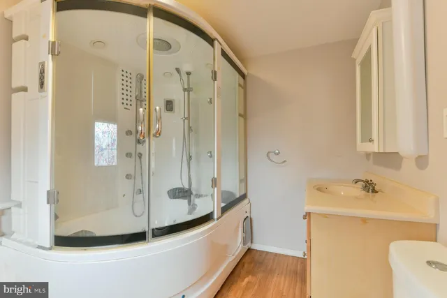 a bathroom with a tub and a shower