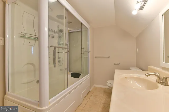 a bathroom with a sink and a shower