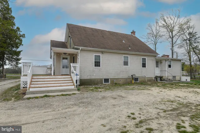 a house that has a tree in front of it