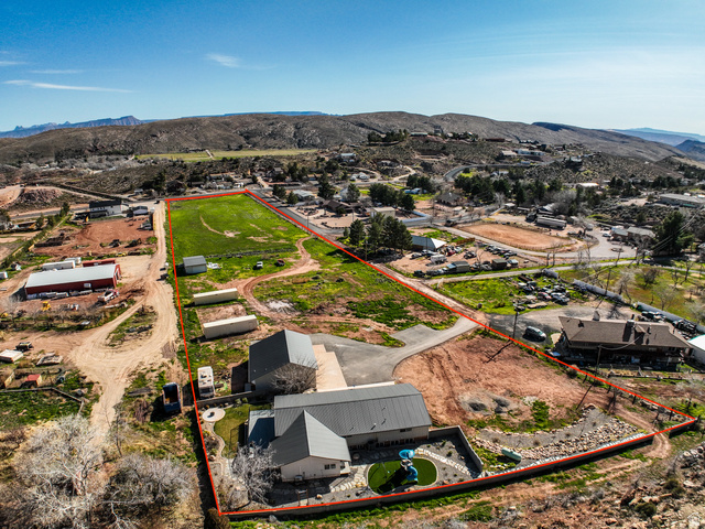 422 West Buckeye Reef Road Leeds, UT 84746 - Photo 12 of 47 Aerial view of property's location featuring property boundaries highlighted and a mountain backdrop