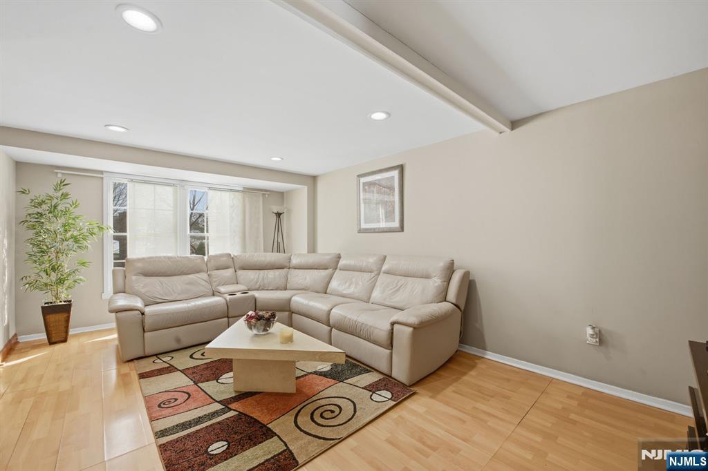 41 Woodland Road Bloomfield, NJ 07003 - Photo 12 of 27 a living room with furniture and a large window