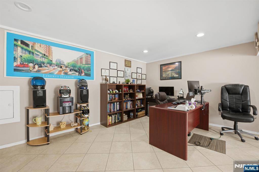 41 Woodland Road Bloomfield, NJ 07003 - Photo 14 of 27 a view of a workspace with furniture and a window