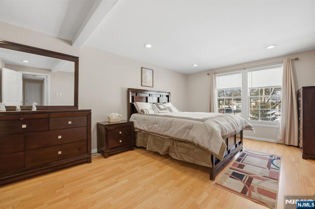 41 Woodland Road Bloomfield, NJ 07003 - Photo 15 of 27 a bedroom with a bed and a large mirror