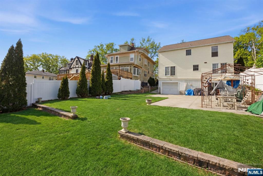 41 Woodland Road Bloomfield, NJ 07003 - Photo 2 of 27 a view of an house with backyard and a tree