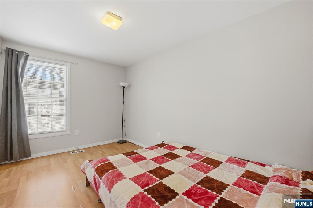 41 Woodland Road Bloomfield, NJ 07003 - Photo 21 of 27 a bedroom with a bed and a window