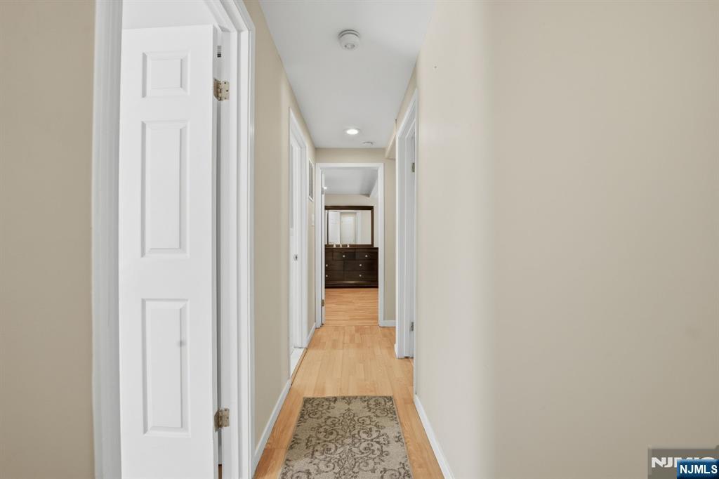41 Woodland Road Bloomfield, NJ 07003 - Photo 22 of 27 a view of a hallway with wooden floor and entryway
