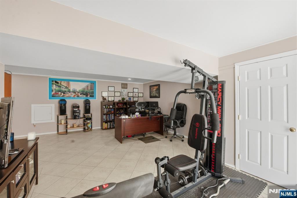 41 Woodland Road Bloomfield, NJ 07003 - Photo 24 of 27 a view of a room with gym equipment