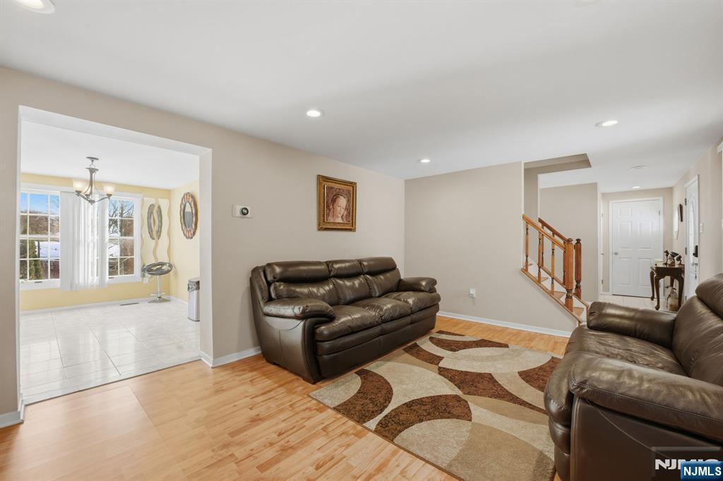 41 Woodland Road Bloomfield, NJ 07003 - Photo 5 of 27 a living room with furniture and a flat screen tv