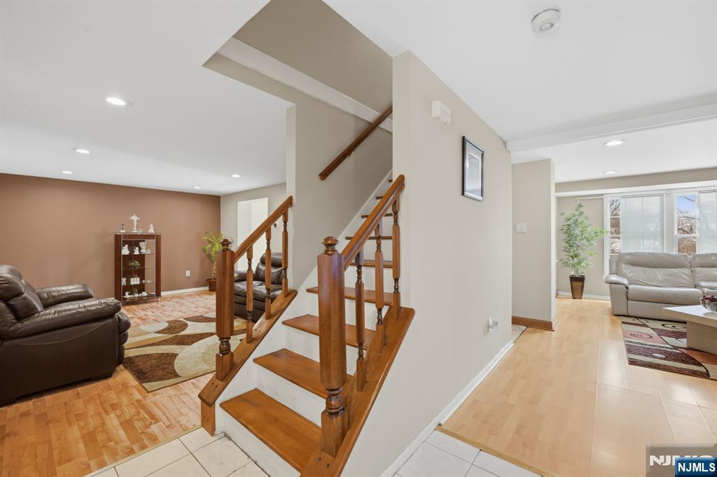 41 Woodland Road Bloomfield, NJ 07003 - Photo 6 of 27 a living room with furniture and a flat screen tv