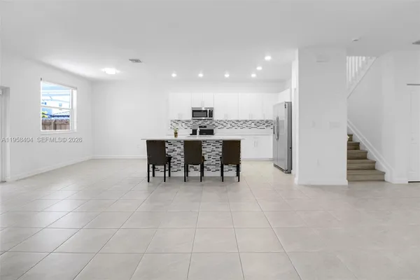 a view of a dining room with furniture