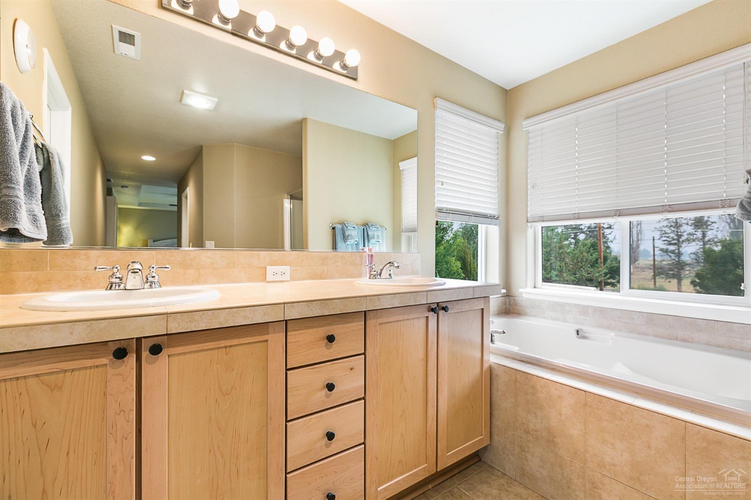 2903 Southwest 50th Street Redmond, OR 97756 - Photo 15 of 24 Soak in the tub and take in the view of