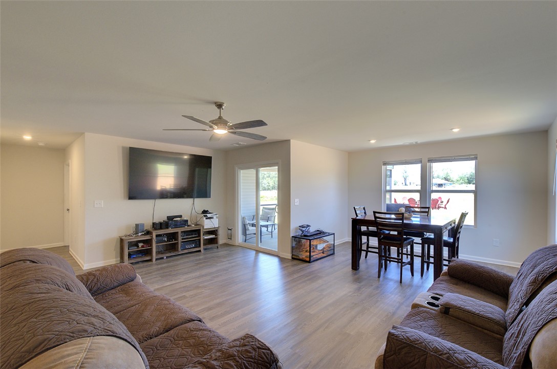 408 Chadwick Lane Walhalla, SC 29691 - Photo 7 of 44 A well-lit, combined living and dining space features durable flooring and convenient patio access.
