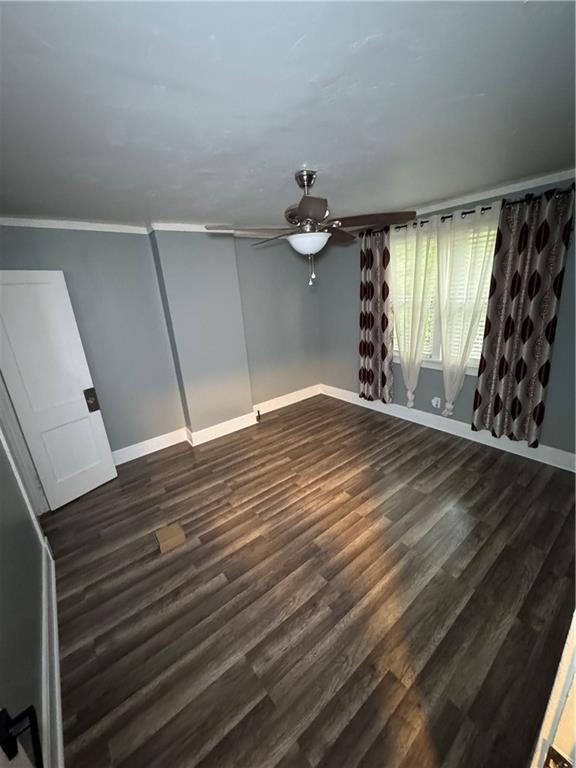 649 Singer Place Pittsburgh, PA 15221 - Photo 11 of 20 a view of an empty room with wooden floor and a window