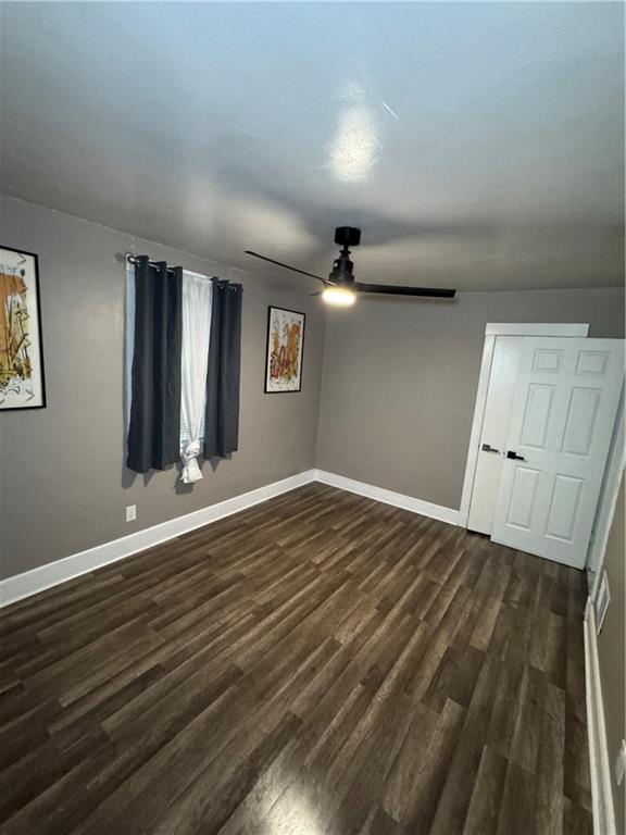 649 Singer Place Pittsburgh, PA 15221 - Photo 12 of 20 a view of an empty room with wooden floor and a window