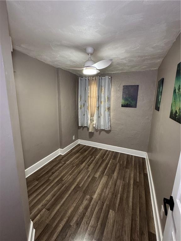 649 Singer Place Pittsburgh, PA 15221 - Photo 15 of 20 a view of an empty room with wooden floor and a window