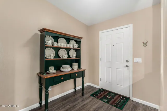 a view of an entryway with wooden floor