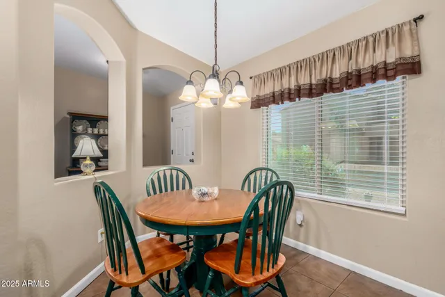 a view of a dining room with furniture and window