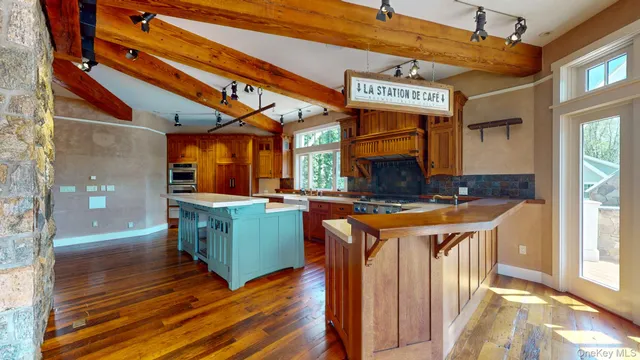 a view of an entryway with wooden floor and windows
