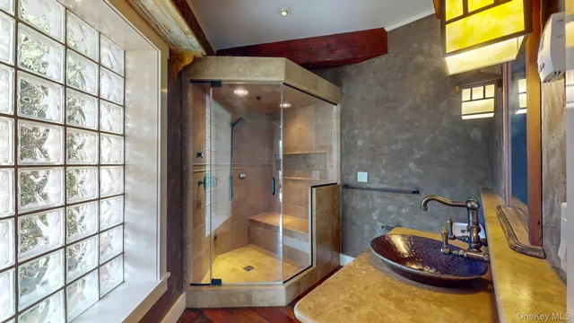 a aerial view of a house with a yard table and chairs