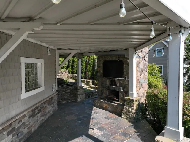 an aerial view of a house with a yard basket ball court and outdoor seating