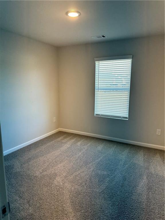 11067 Suria Drive Covington, GA 30014 - Photo 11 of 22 an empty room with a window
