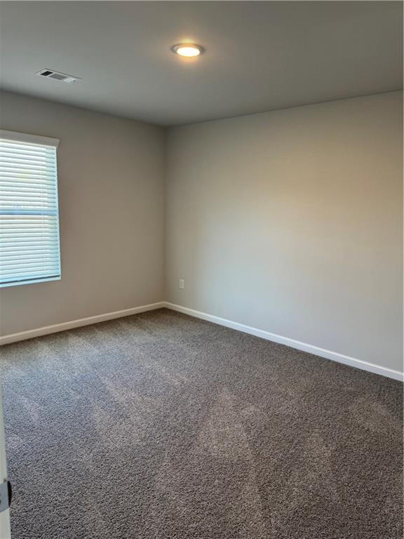 11067 Suria Drive Covington, GA 30014 - Photo 13 of 22 an empty room with a window
