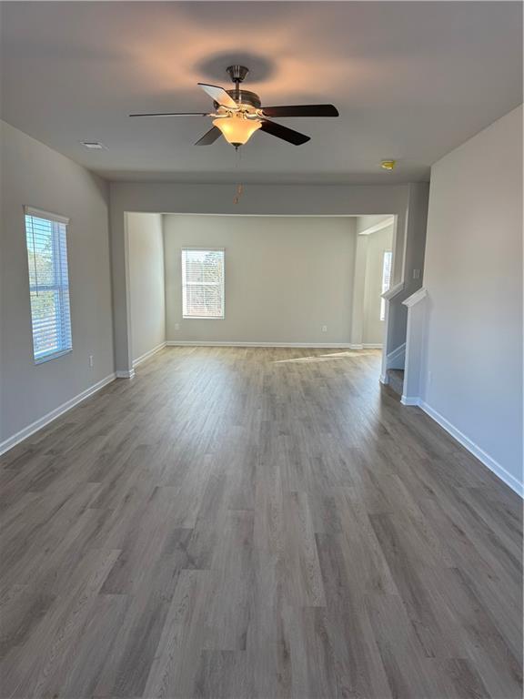11067 Suria Drive Covington, GA 30014 - Photo 2 of 22 a view of empty room with wooden floor