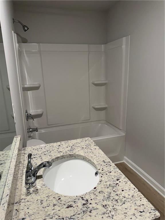 11067 Suria Drive Covington, GA 30014 - Photo 10 of 22 a bathroom with a sink and a mirror