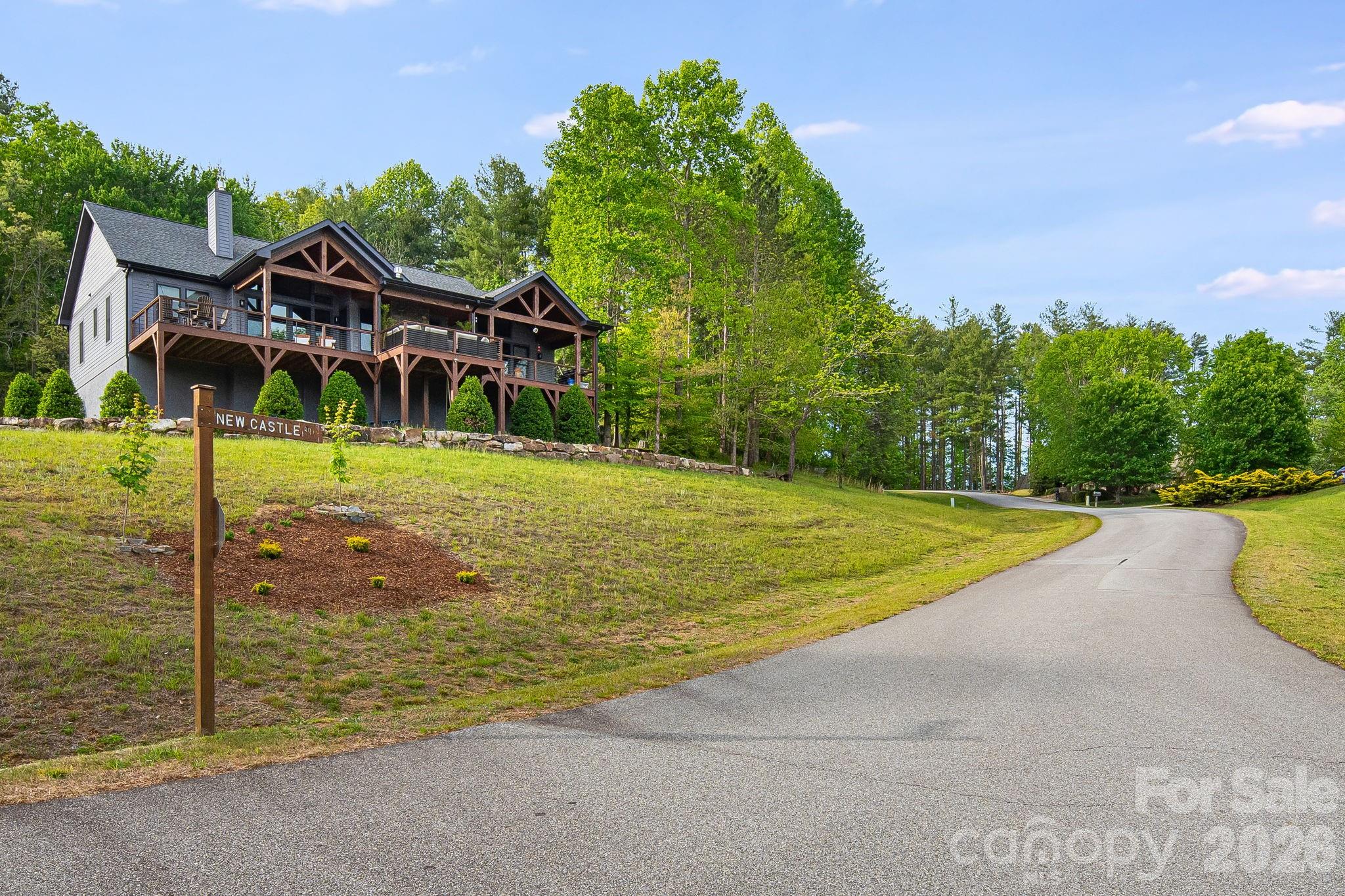 0 Newcastle Road, Unit 52 Brevard, NC 28712 - Photo 16 of 29 a view of a house with pool and a yard