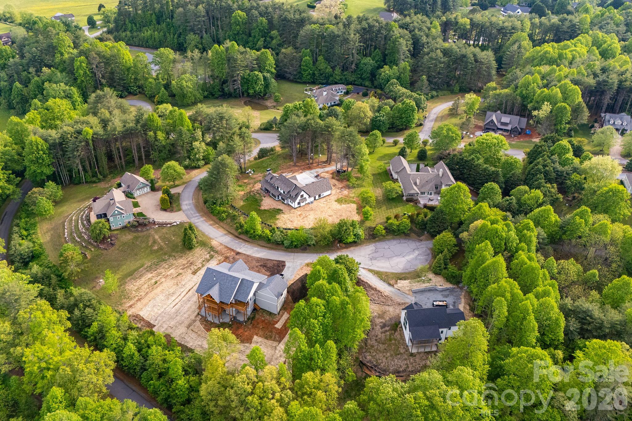 0 Newcastle Road, Unit 52 Brevard, NC 28712 - Photo 25 of 29 an aerial view of a house with a yard and lake view