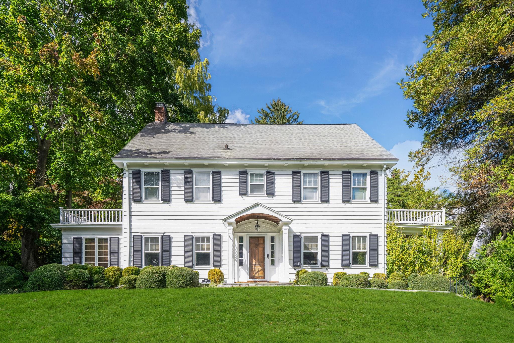 105 Walworth Avenue Scarsdale, NY 10583 - Photo 1 of 48 front view of a house with a yard
