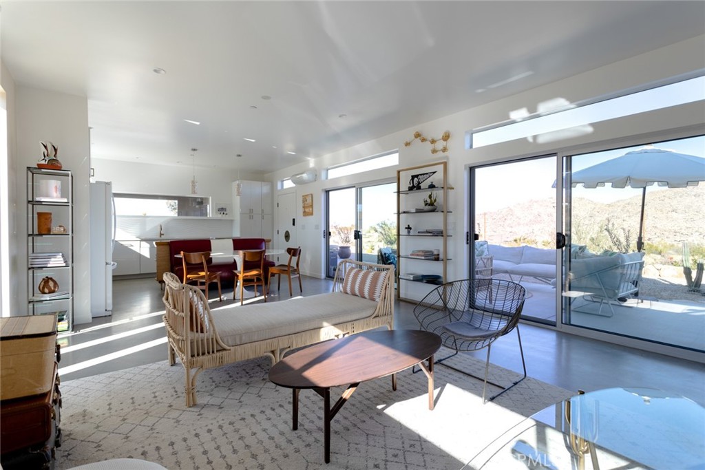 7802 Quail Springs Road Joshua Tree, CA 92252 - Photo 11 of 46 a living room with furniture and a large window