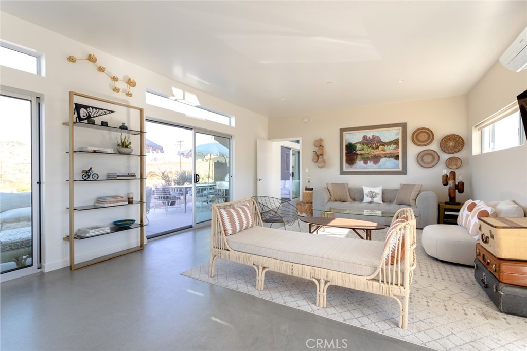 7802 Quail Springs Road Joshua Tree, CA 92252 - Photo 15 of 46 a living room with furniture and a large window