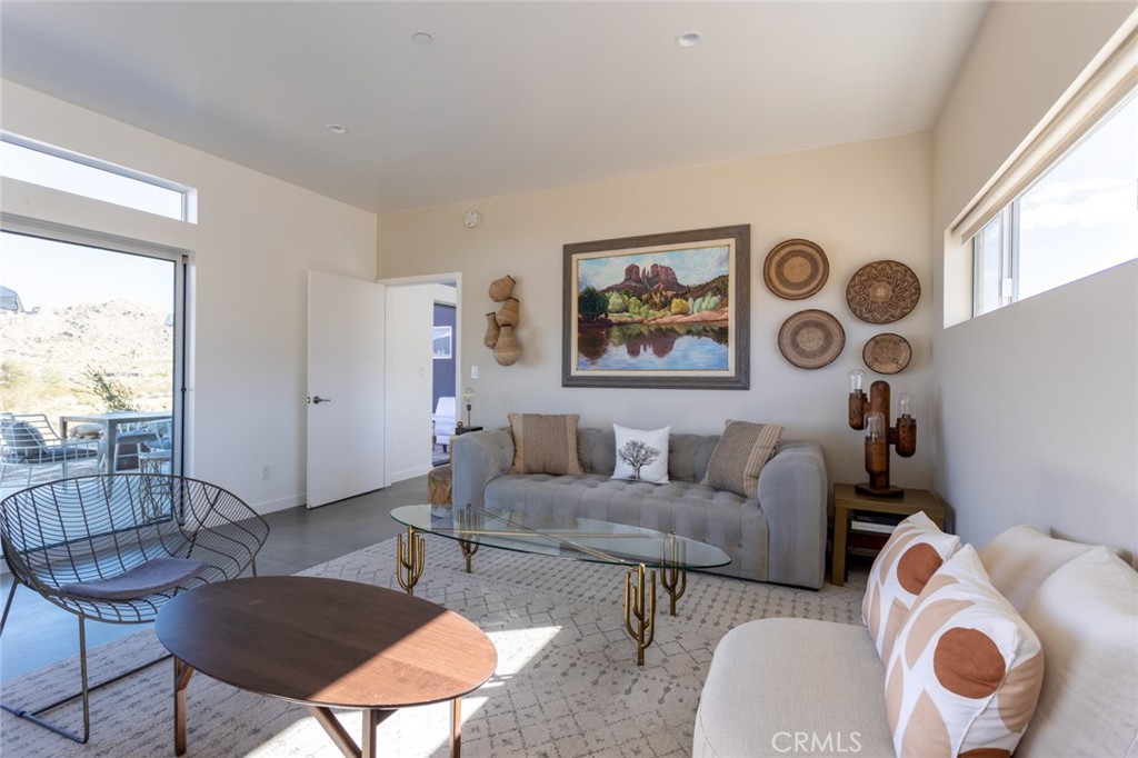 7802 Quail Springs Road Joshua Tree, CA 92252 - Photo 16 of 46 a living room with furniture and a window