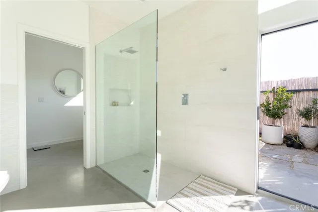 a spacious bathroom with a bathtub and shower